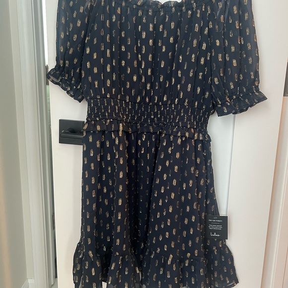 Lulu’s Touch of Glam Navy Blue Dotted Off-the-
Shoulder Mini Dress - Picture 1 of 4